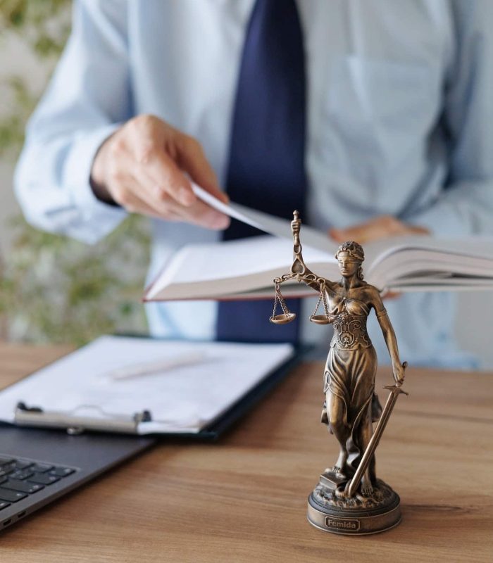 a male lawyer in a blue shirt and tie in the office. legal advice in the office or online, Freehold Solicitors