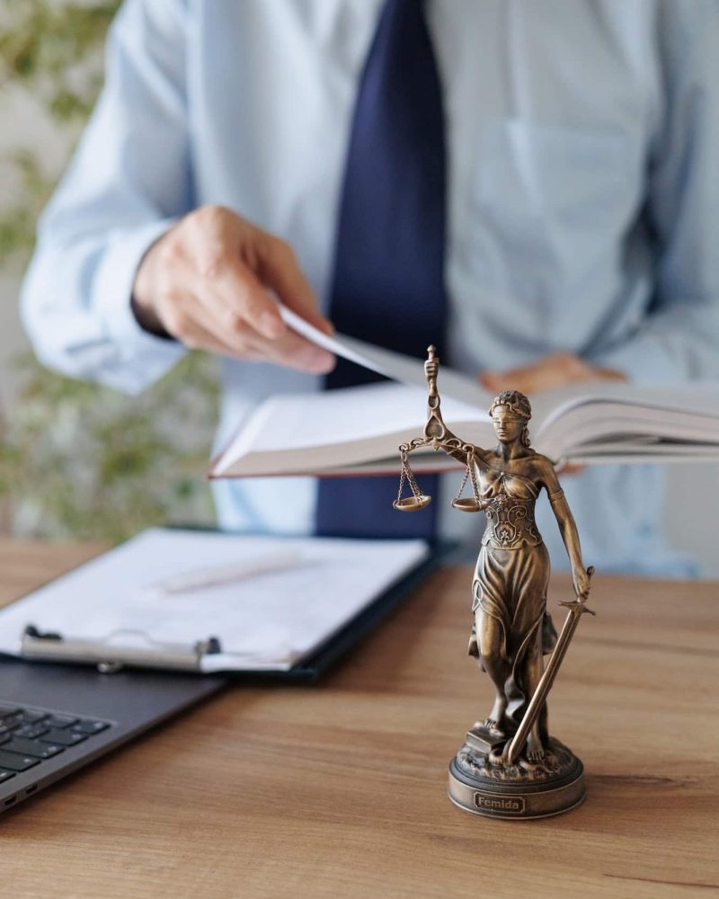 a male lawyer in a blue shirt and tie in the office. legal advice in the office or online, Freehold Solicitors