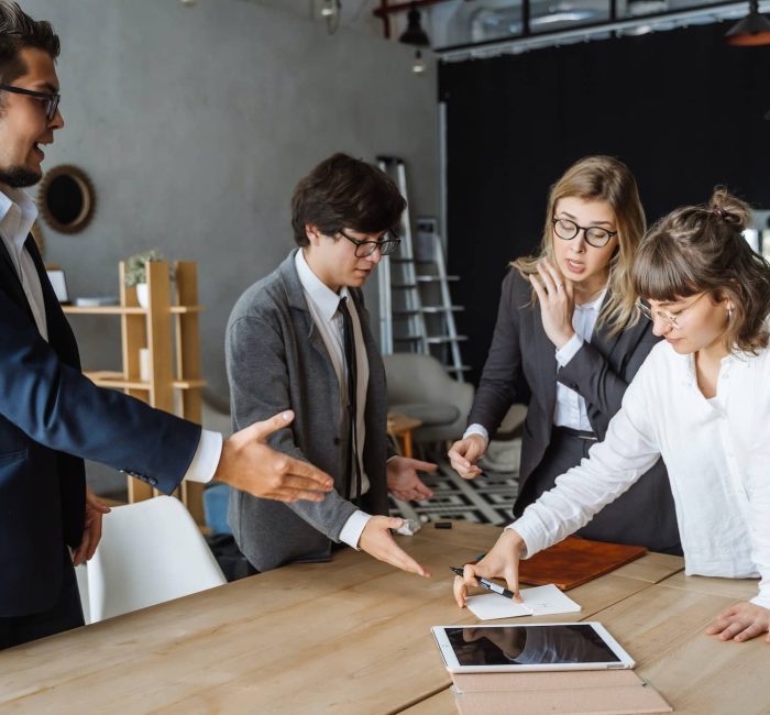 Business people having discussion, dispute or disagreement at meeting or negotiations