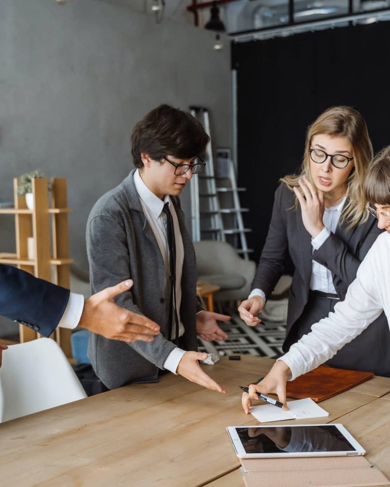 Business people having discussion, dispute or disagreement at meeting or negotiations