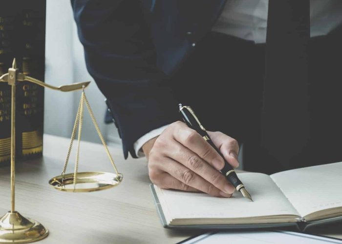 Lawyer hand holding pen and providing legal consult business dispute service at the office, Mortgage Fraud Lawyer, Lawyers For Online Business