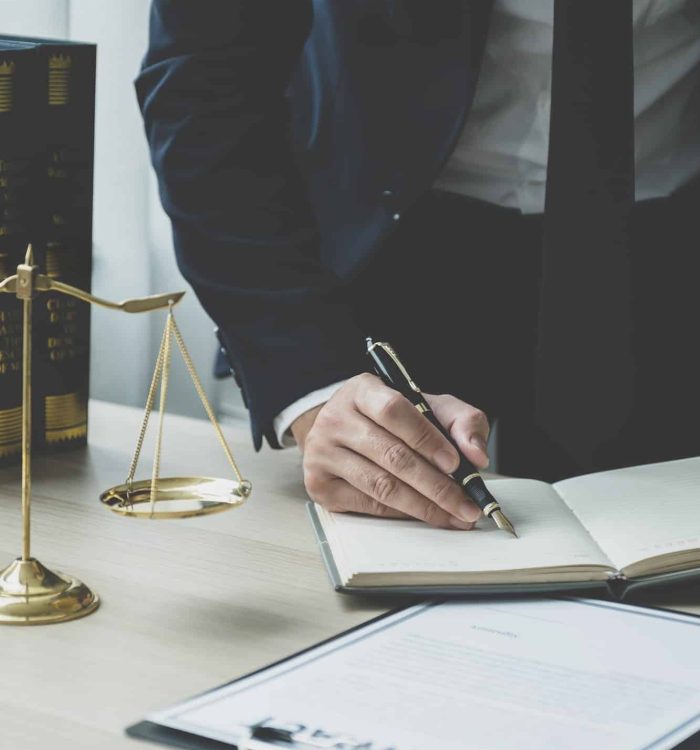 Lawyer hand holding pen and providing legal consult business dispute service at the office, Mortgage Fraud Lawyer, Lawyers For Online Business