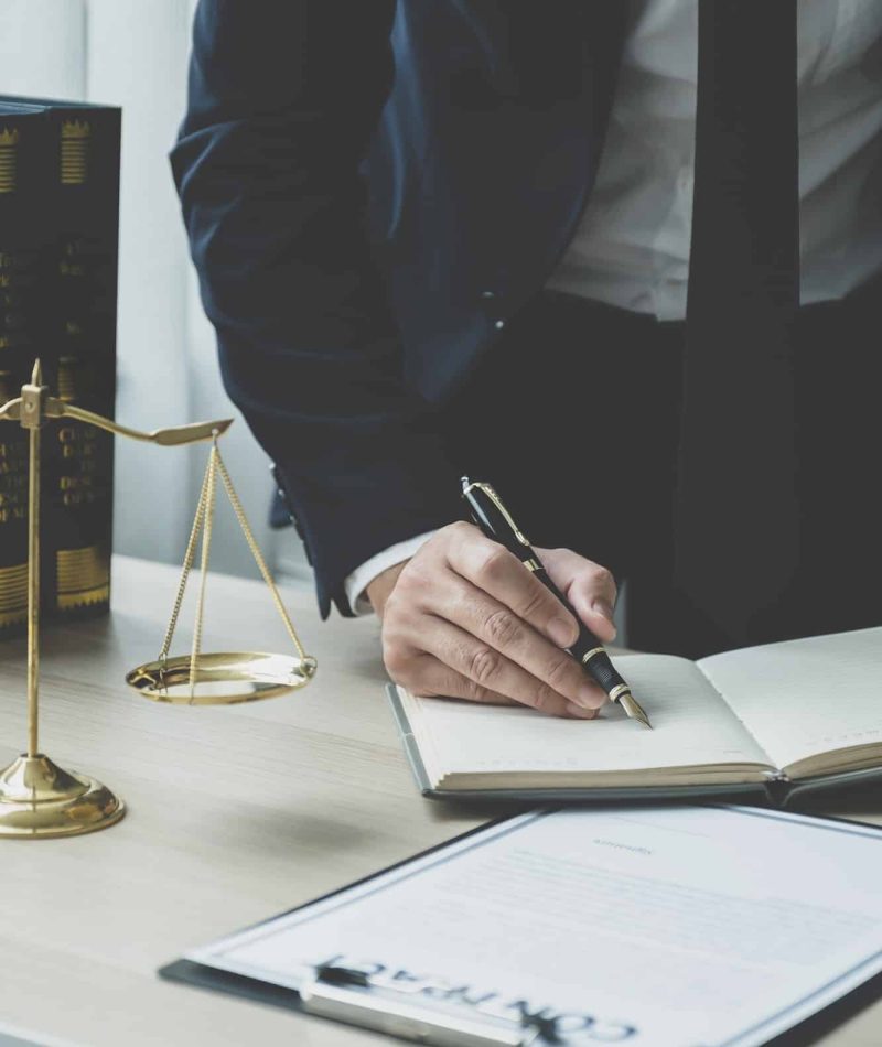 Lawyer hand holding pen and providing legal consult business dispute service at the office, Mortgage Fraud Lawyer, Lawyers For Online Business