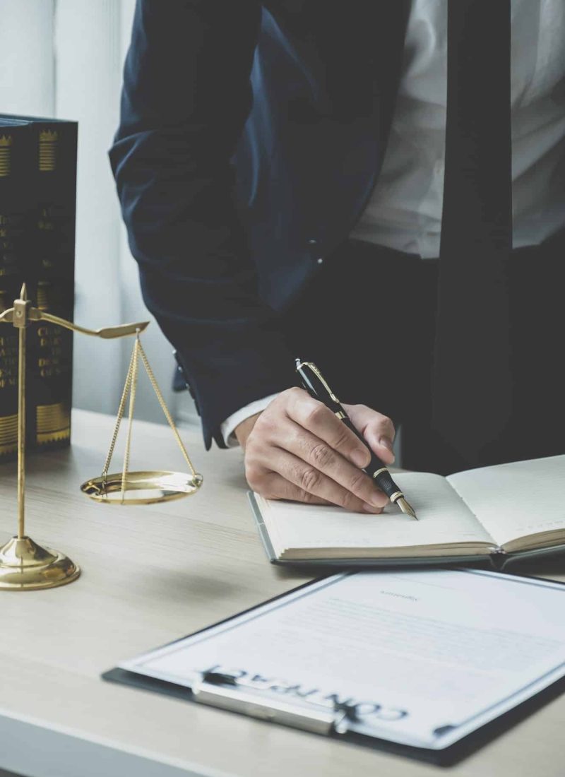 Lawyer hand holding pen and providing legal consult business dispute service at the office, Mortgage Fraud Lawyer, Lawyers For Online Business