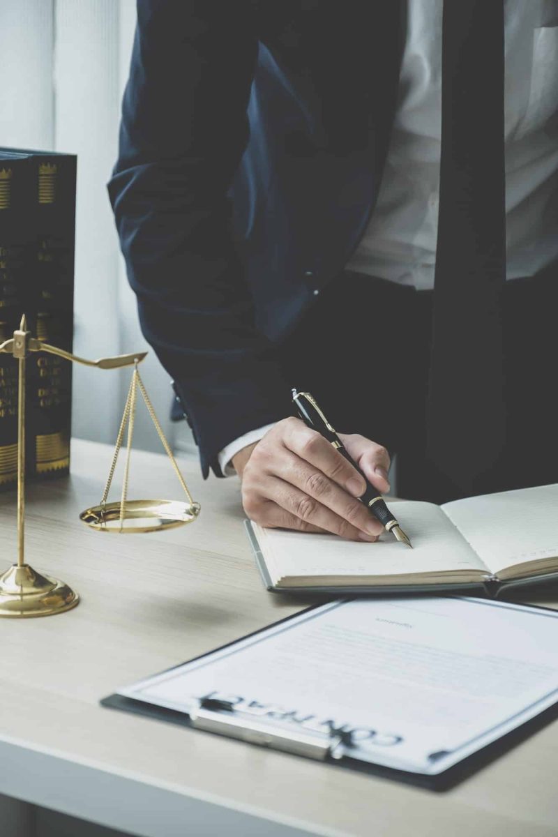 Lawyer hand holding pen and providing legal consult business dispute service at the office, Mortgage Fraud Lawyer, Lawyers For Online Business