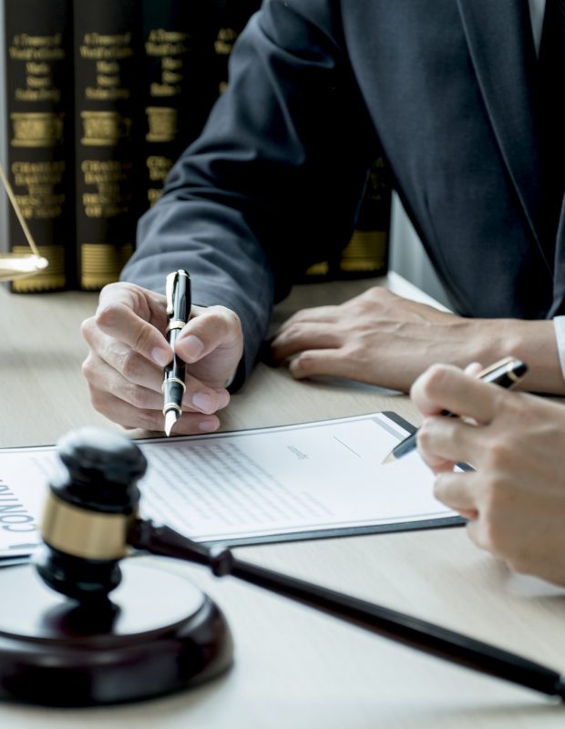 Lawyer hand holding pen and providing legal consult business dispute to the man