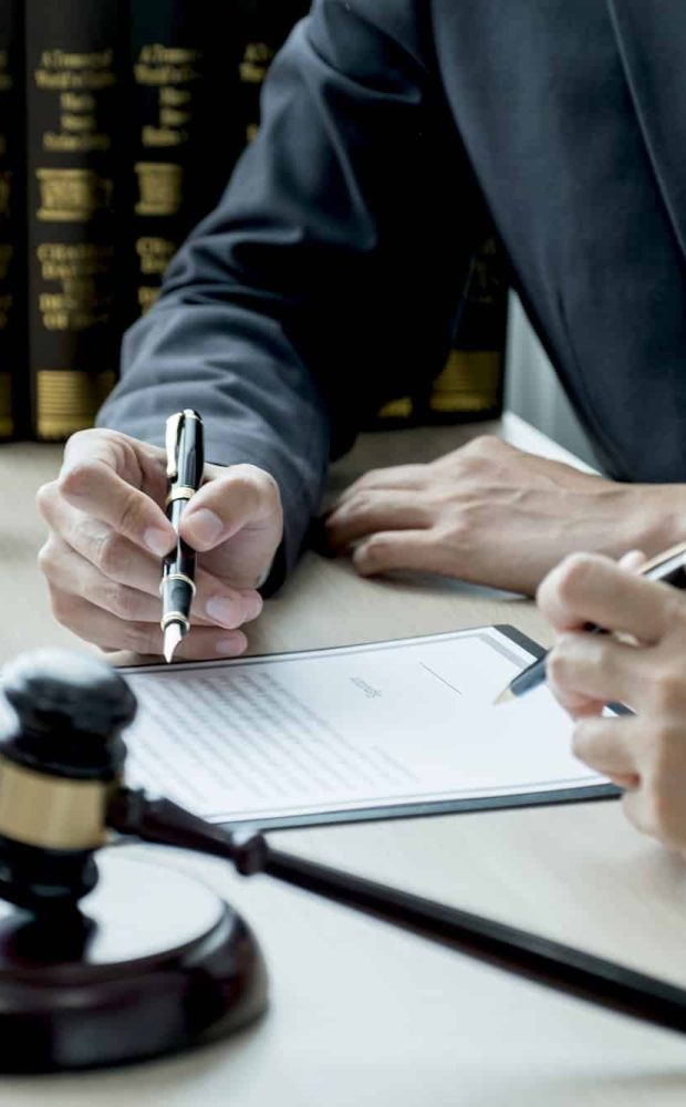 Lawyer hand holding pen and providing legal consult business dispute to the man