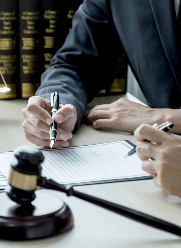Lawyer hand holding pen and providing legal consult business dispute to the man