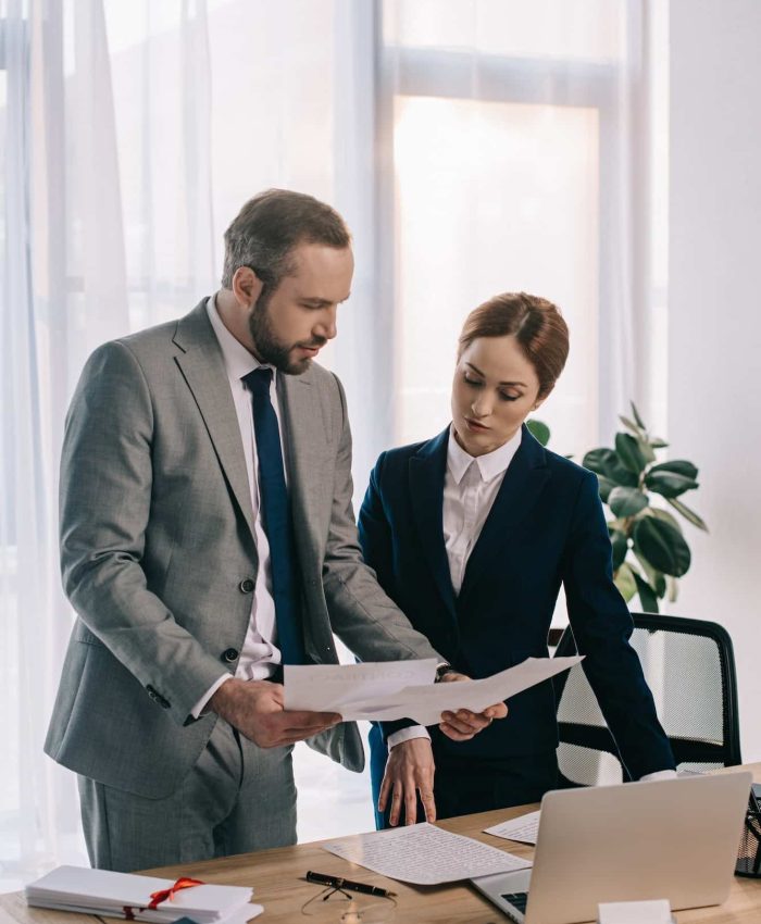 lawyers in suits working together on project at workplace with gavel and laptop in office, Private Equity Lawyer