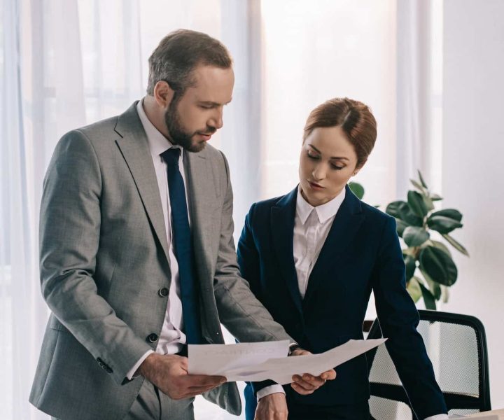 lawyers in suits working together on project at workplace with gavel and laptop in office, Private Equity Lawyer