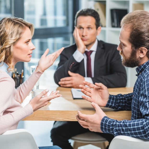 side-view-of-couple-arguing-at-workplace-in-lawyer-office.jpg