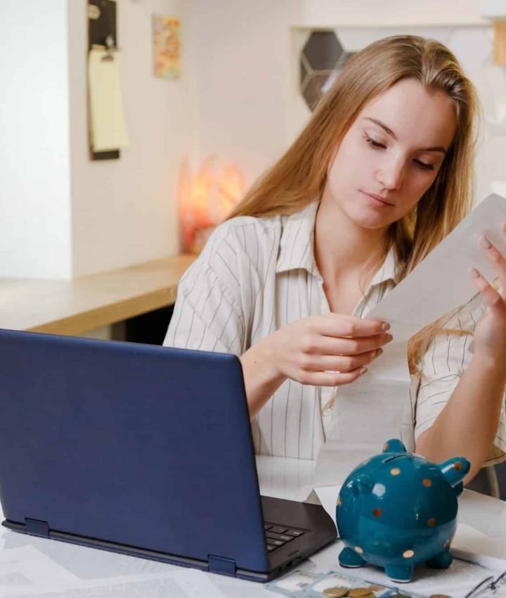 Woman checks sales receipt after shopping. Returning goods, calculating costs, planning own budget, Healthcare Lawyer