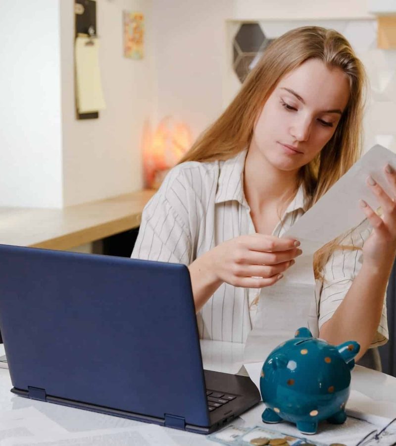 Woman checks sales receipt after shopping. Returning goods, calculating costs, planning own budget, Healthcare Lawyer