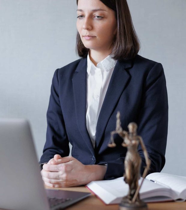 woman lawyer or lawyer in her office conducts an online consultation or webinar on legal services, Breach of Contract Solicitors