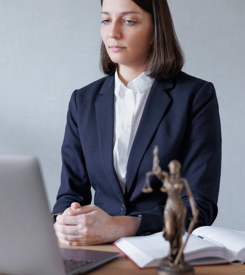 woman lawyer or lawyer in her office conducts an online consultation or webinar on legal services, Breach of Contract Solicitors